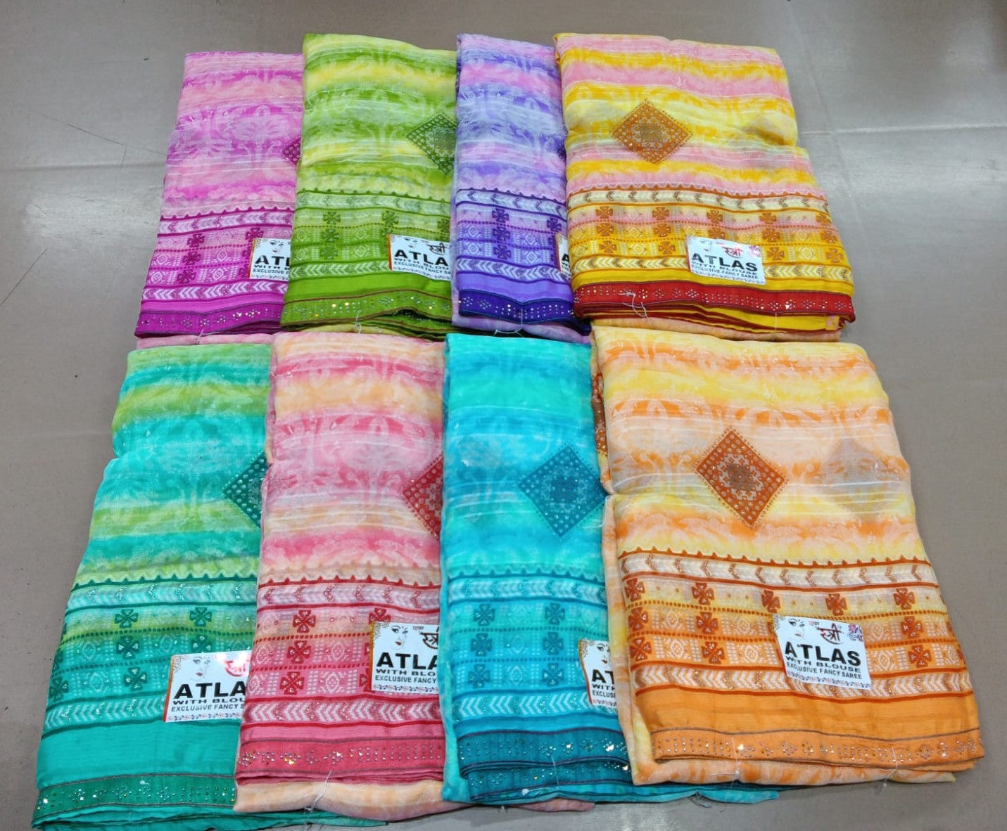 Atlas-02 Ekstree Weightless Fancy Print Saree Set – 8 Pcs -M.R. Saree Emporium